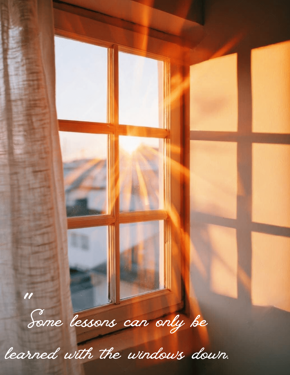 Sunlit window with sheer curtains; warm orange light casts shadows on the wall, overlaid with the cursive quote: 'Some lessons can only be learned with the windows down.'
